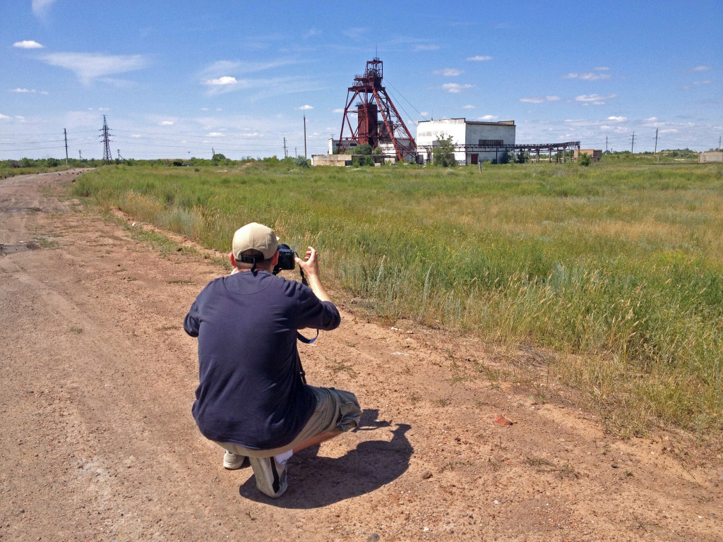 Theo taking photos from the mass grave.